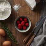 Custom illustration showing fake software installers with TamperedChef branding dropping a hidden JavaScript backdoor on a workstation.